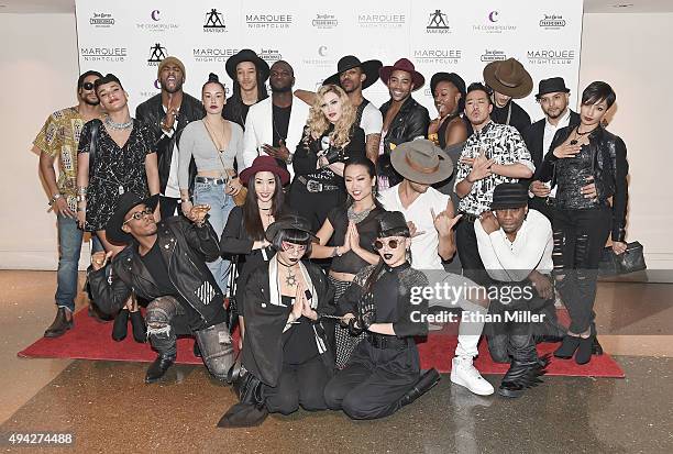 Singer Madonna is surrounded by her dancers as they arrive at the Marquee Nightclub at The Cosmopolitan of Las Vegas to host an after party for their...