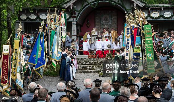 Pilgrims in traditional Bavarian folk costumes attend an outdoor mass to celebrate Ascension at the open-air altar at Birkenstein on May 29, 2014...