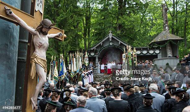 Pilgrims in traditional Bavarian folk costumes attend an outdoor mass to celebrate Ascension at the open-air altar at Birkenstein on May 29, 2014...