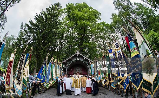 Pilgrims in traditional Bavarian folk costumes attend an outdoor mass to celebrate Ascension at the open-air altar at Birkenstein on May 29, 2014...