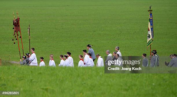 Pilgrims in traditional Bavarian folk costumes march to an outdoor mass to celebrate Ascension at the open-air altar at Birkenstein on May 29, 2014...