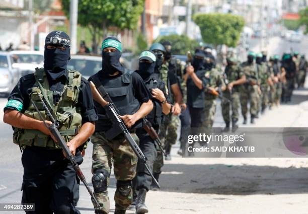 Palestinian militants of the Ezzedine al-Qassam Brigades, Hamas's armed wing, parade in Rafah, southern Gaza Strip, on May 29, 2014. Palestinian...