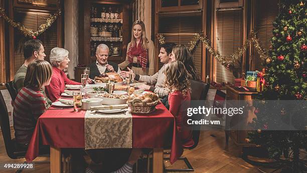 large family celebrating christmas holiday - christmas mince pies stock pictures, royalty-free photos & images