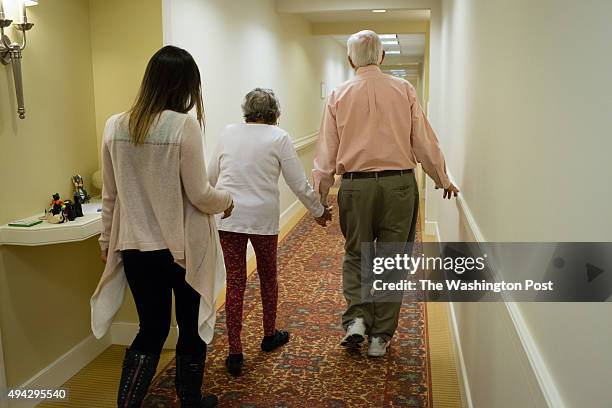 Maggie Gonzalez takes care of her grandparents, John L. And Susan duFief, both 85, at least 12 hours per week and sometimes more. Gonzalez walks down...