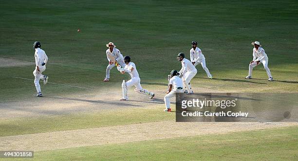 Mark Wood of England bats surrounded by Pakistan fielders during day five of the 2nd test match between Pakistan and England at Dubai Cricket Stadium...
