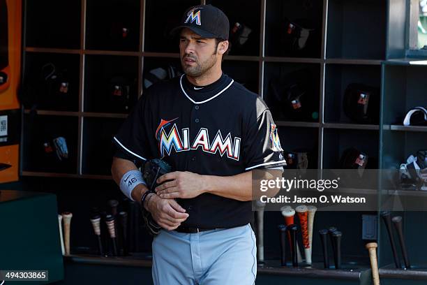 Garrett Jones of the Miami Marlins stands in the dugout before the game against the San Francisco Giants at AT&T Park on May 18, 2014 in San...