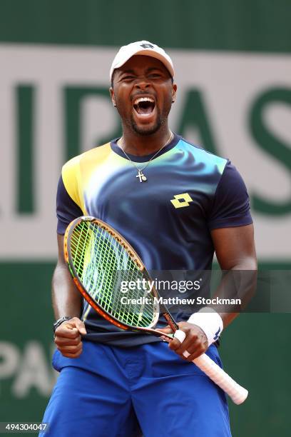 Donald Young of the United States celebrates victory in his men's singles match against Feliciano Lopez of Spain on day five of the French Open at...