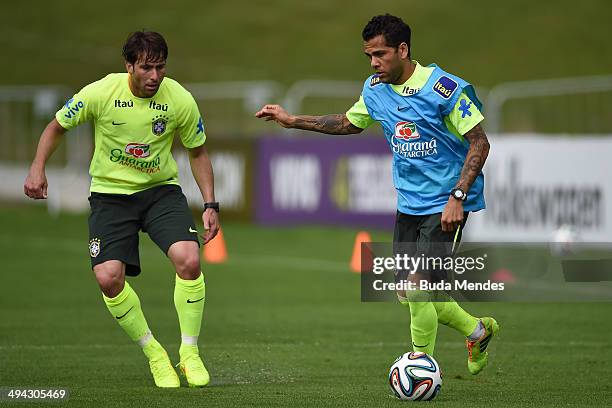 Maxwell and Daniel Alves take part in a training session of the Brazilian national football team at the squad's Granja Comary training complex, in...
