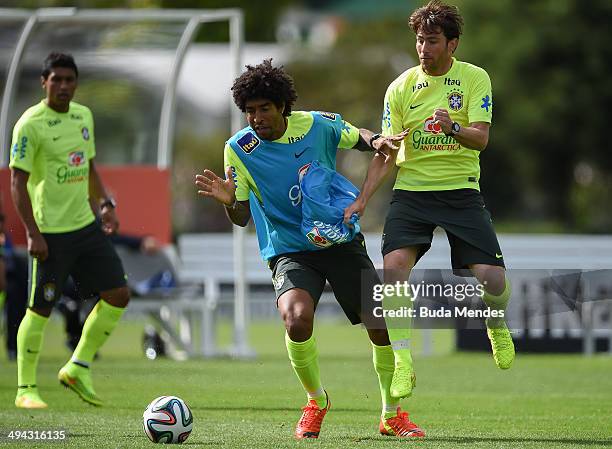 Dante and Maxwell take part in a training session of the Brazilian national football team at the squad's Granja Comary training complex, in...