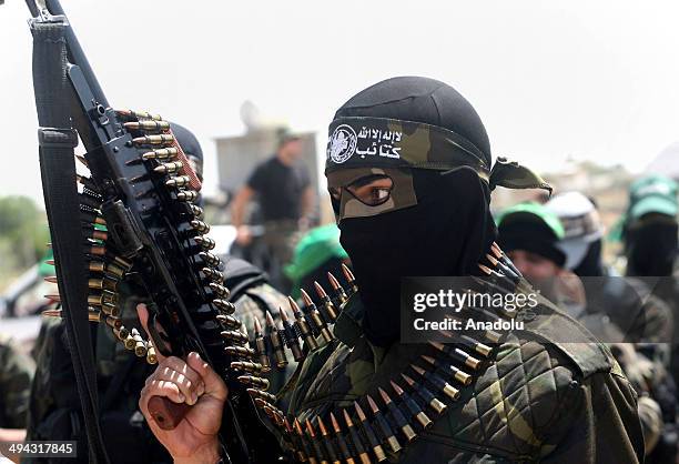 Members of the Ezzedine al-Qassam Brigades, Hamas' armed wing, parade in Rafah, southern Gaza Strip, on May 29, 2014. Palestinian President Mahmoud...