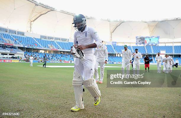 Adil Rashid of England leaves the field after losing the 2nd test match between Pakistan and England at Dubai Cricket Stadium on October 25, 2015 in...