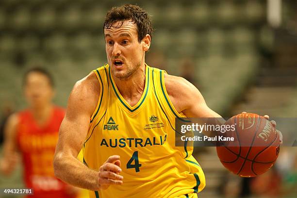 Ben Madgen of Australia brings the ball up the court during the 2014 Sino-Australia Challenge match between Australia and China at Challenge Stadium...