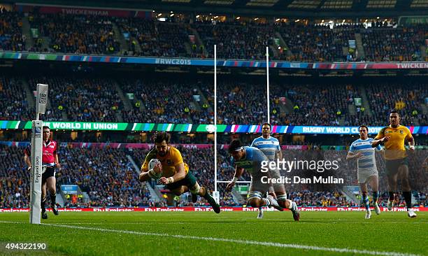 Adam Ashley-Cooper of Australia dives over to scores his sides second try during the 2015 Rugby World Cup Semi Final match between Argentina and...