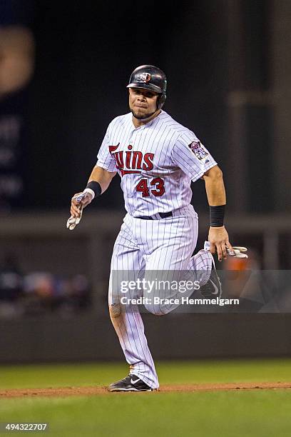 Josmil Pinto of the Minnesota Twins runs against the Seattle Mariners on May 16, 2014 at Target Field in Minneapolis, Minnesota. The Twins defeated...