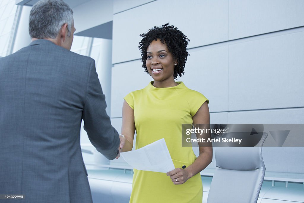 Business people shaking hands in meeting