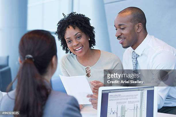 couple talking to loan officer - credit union fotografías e imágenes de stock