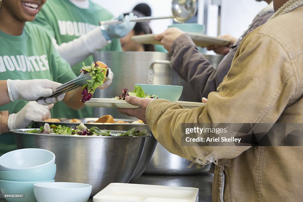 Volunteers working in soup kitchen