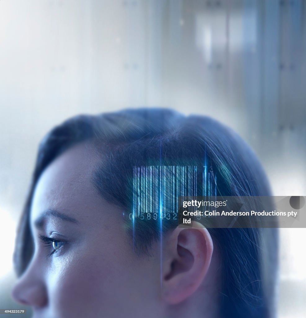 Mixed race woman with barcode in head