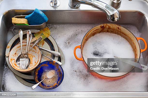 kitchen sink full of dirty dishes - dirty sink stock pictures, royalty-free photos & images