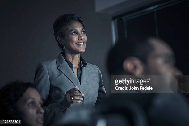 business people watching audio visual presentation in meeting - focus on background stock pictures, royalty-free photos & images