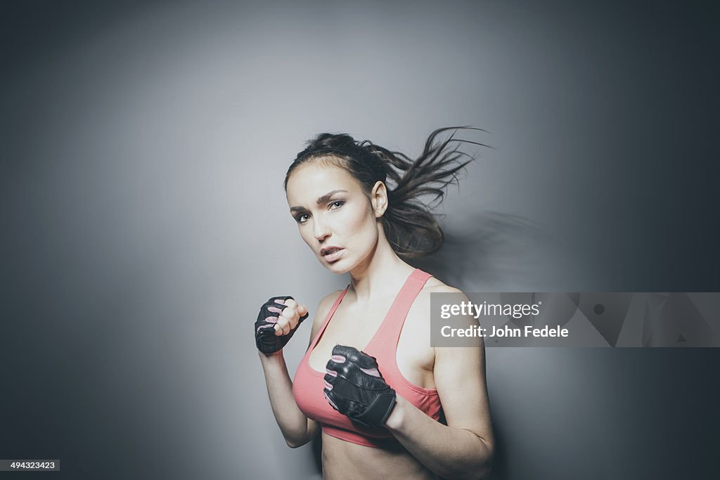 Portrait of Caucasian woman in fighting stance