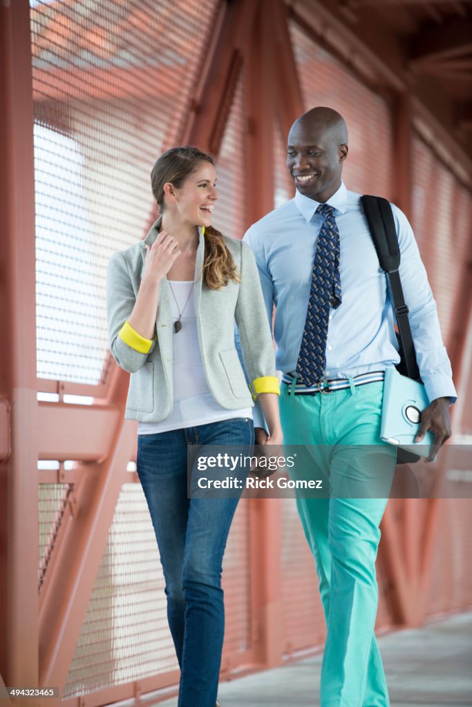 Couple holding hands on walkway
