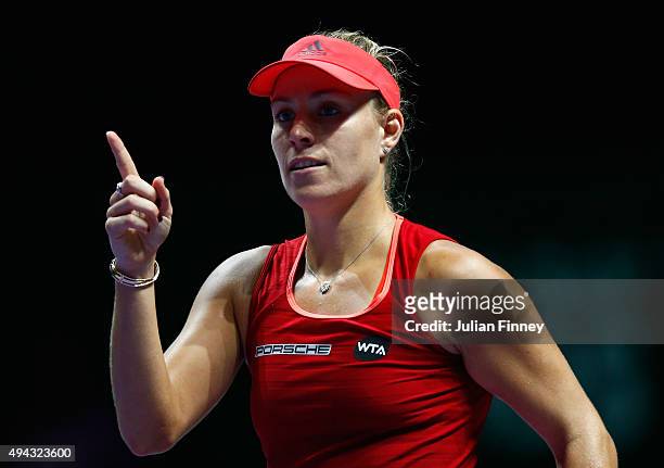Angelique Kerber of Germany celebrates match point against Petra Kvitova of Czech Republic in a round robin match during the BNP Paribas WTA Finals...