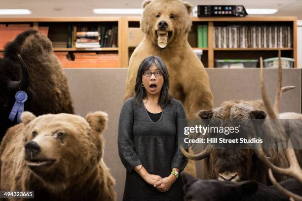 filipino woman gasping in natural history museum - tensed idaho stock pictures, royalty-free photos & images