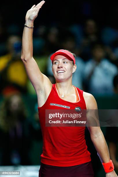 Angelique Kerber of Germany waves to the crowd after defeating Petra Kvitova of Czech Republic in a round robin match during the BNP Paribas WTA...