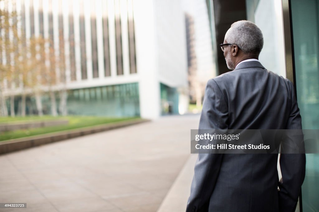 Black businessman standing outdoors