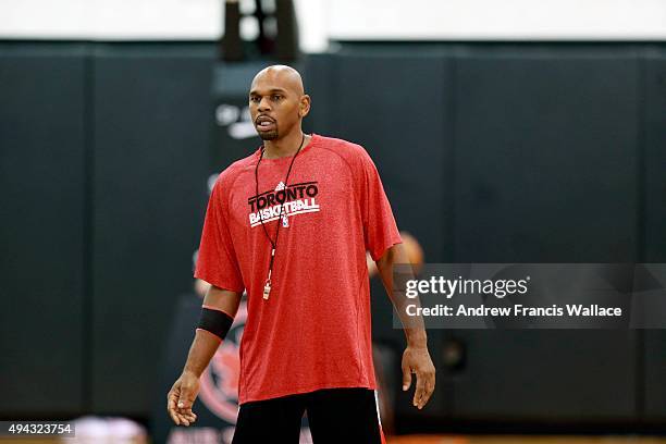 Toronto Raptors' assistant coach Jerry Stackhouse works with guard Shannon Scott at practice.