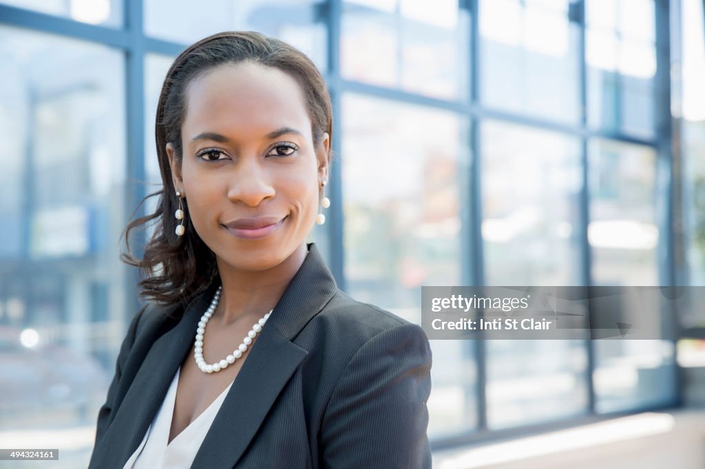 Black businesswoman smiling outdoors