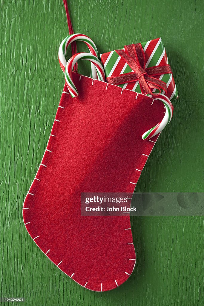 Christmas stocking with gift and candy canes