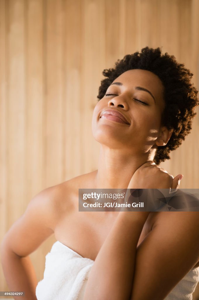Serene Black woman wrapped in a towel