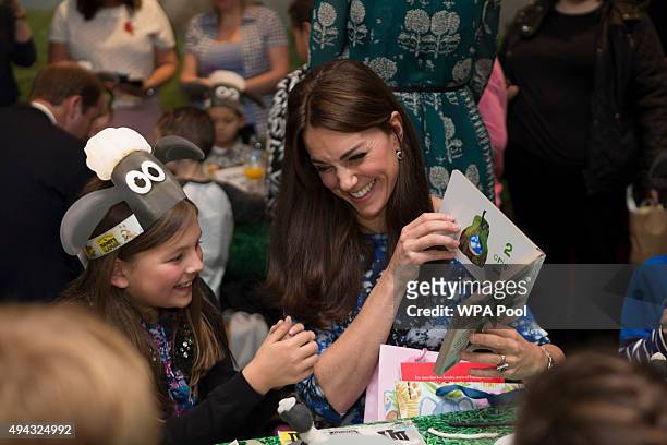 Catherine, Duchess of Cambridge chats with children and representatives from charities and Aardman Animations, during a meeting of the Charities...