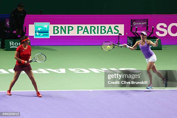 Sania Mirza of India and Martina Hingis of Switzerland in action against Raquel Kops-Jones and Abigail Spears of the USA during the BNP Paribas WTA...