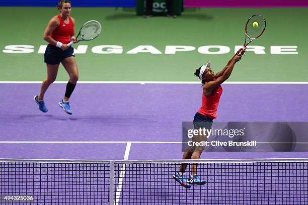 Abigail Spears and Raquel Kops-Jones of the USA in action against Sania Mirza of India and Martina Hingis of Switzerland during the BNP Paribas WTA...