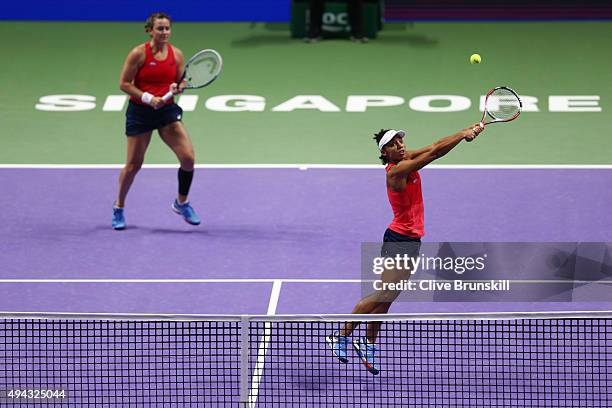 Abigail Spears and Raquel Kops-Jones of the USA in action against Sania Mirza of India and Martina Hingis of Switzerland during the BNP Paribas WTA...