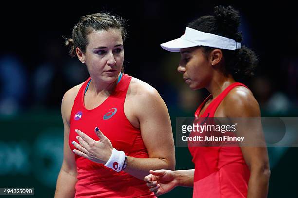 Abigail Spears and Raquel Kops-Jones of the USA in action against Sania Mirza of India and Martina Hingis of Switzerland during the BNP Paribas WTA...