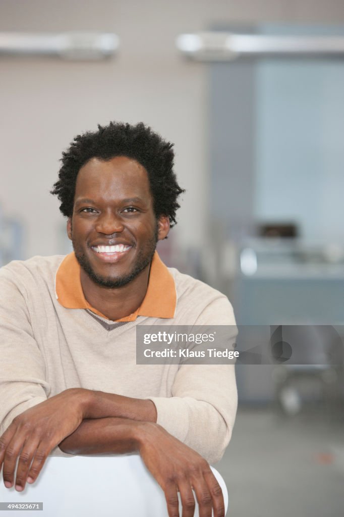 African American businessman smiling in office