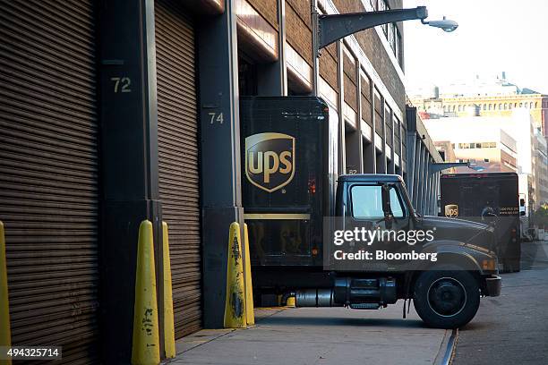 United Parcel Service Inc. Truck backs into a facility in New York, U.S., on Friday, Oct. 23, 2015. UPS is scheduled to release third-quarter...
