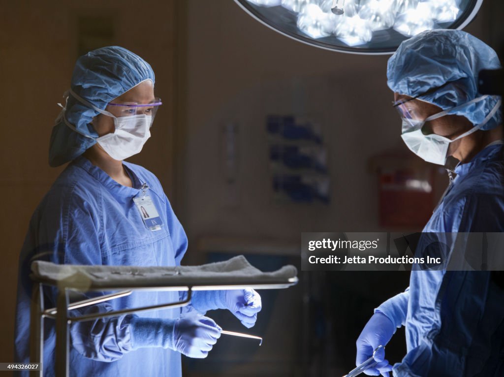 Surgeons working in operating room