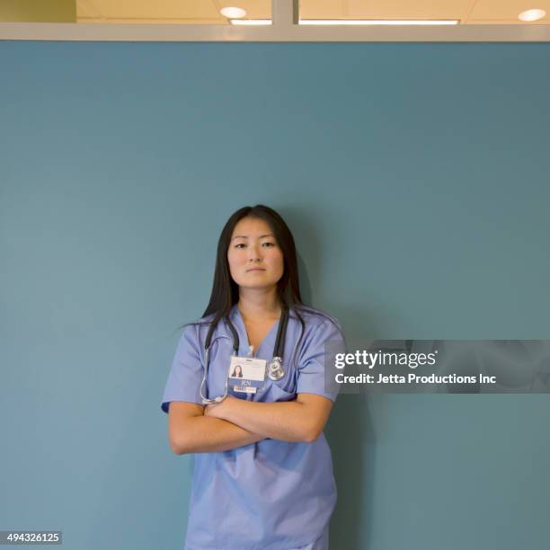 japanese nurse standing in hospital - auscultation woman stockfoto's en -beelden