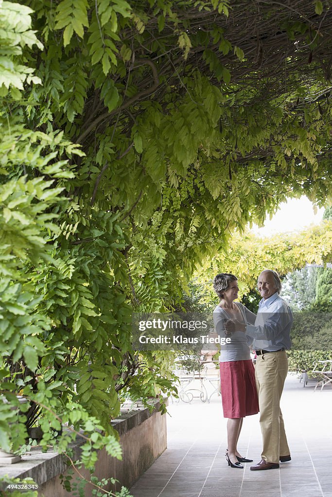 Couple dancing together outdoors