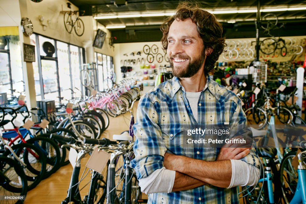 Caucasian man working in bicycle shop