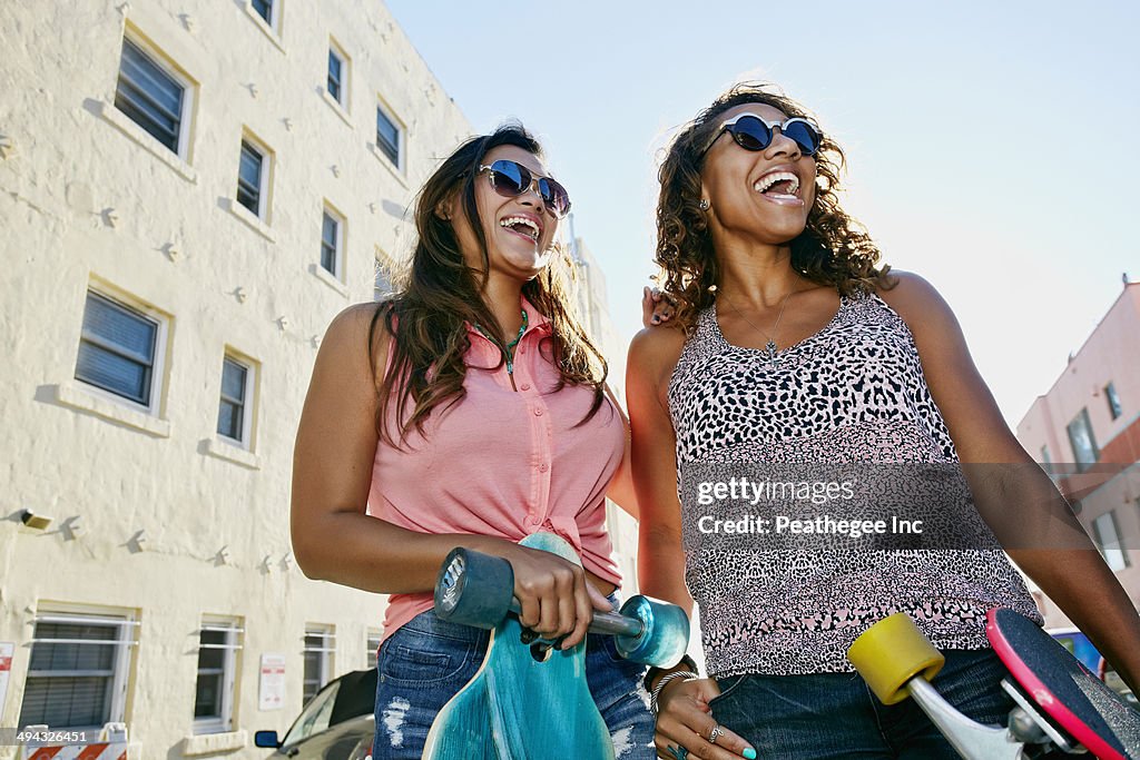 Women laughing on city street