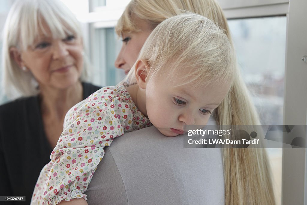 Three generations of Caucasian women by window