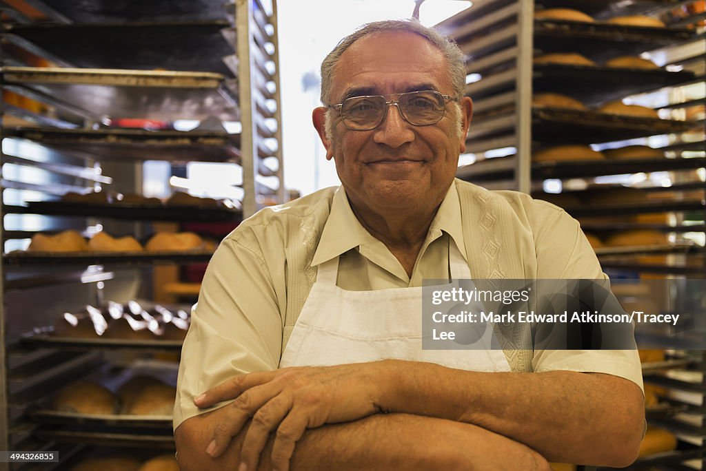 Hispanic baker working in commercial kitchen