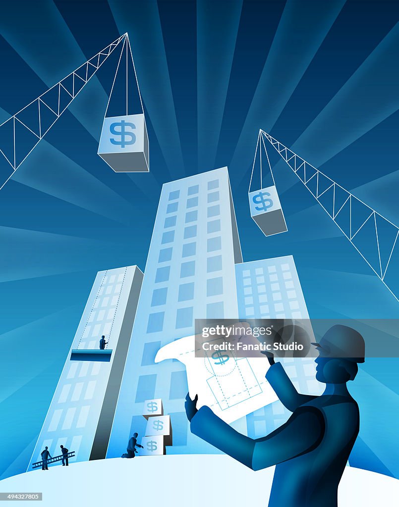 Architect holding a blueprint at a construction site