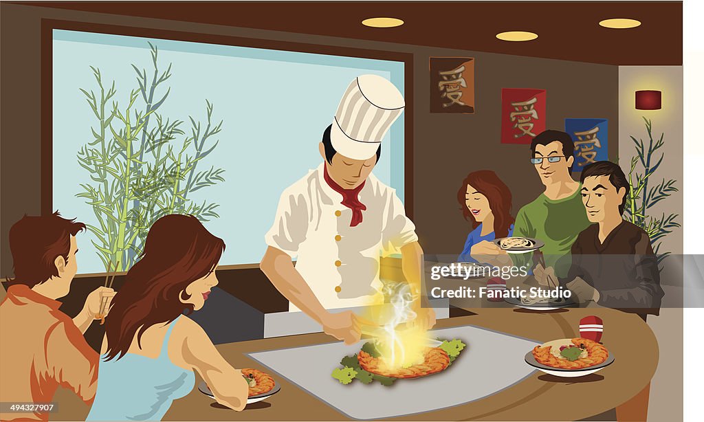 Chef cooking Japanese cuisine in a restaurant